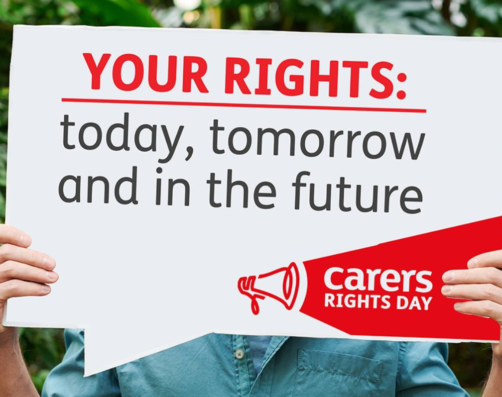 Image shows tow hands holding up a white sign which reads: Your Rights: today, tomorrow and in the future. Image also includes a red logo for Carers Rights Day